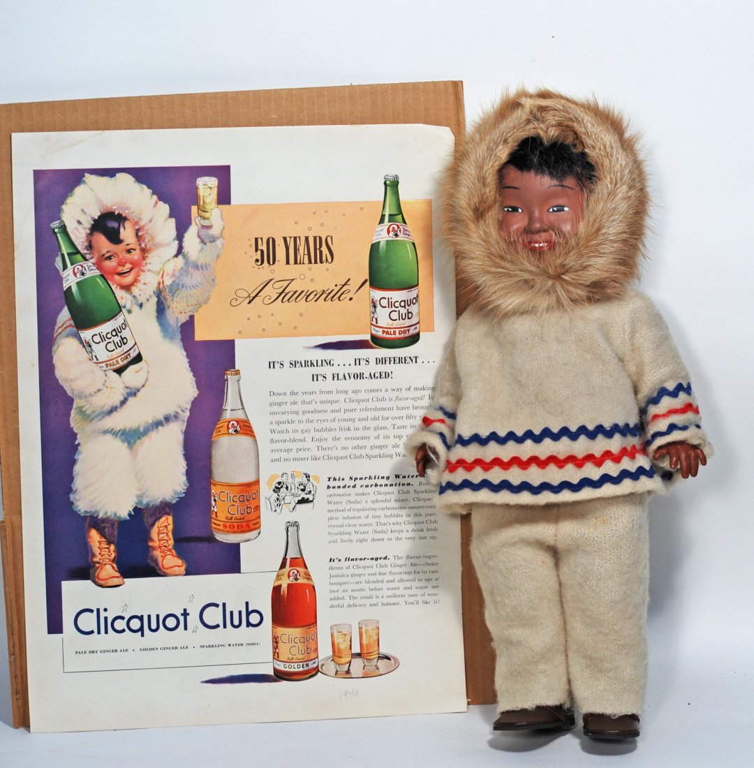 ADVERTISING DOLL "DEE AND CEE" BY KOWEEKA/HUDSON BAY CO: 103. ADVERTISING DOLL â€œDEE AND CEE” BY KOWEEKA/HUDSON BAY CO. 14”. Marks: 1-5 D & C. Brown vinly doll in original fur-trimmed outfit; alon with Clicquot Club advertisement illustrati