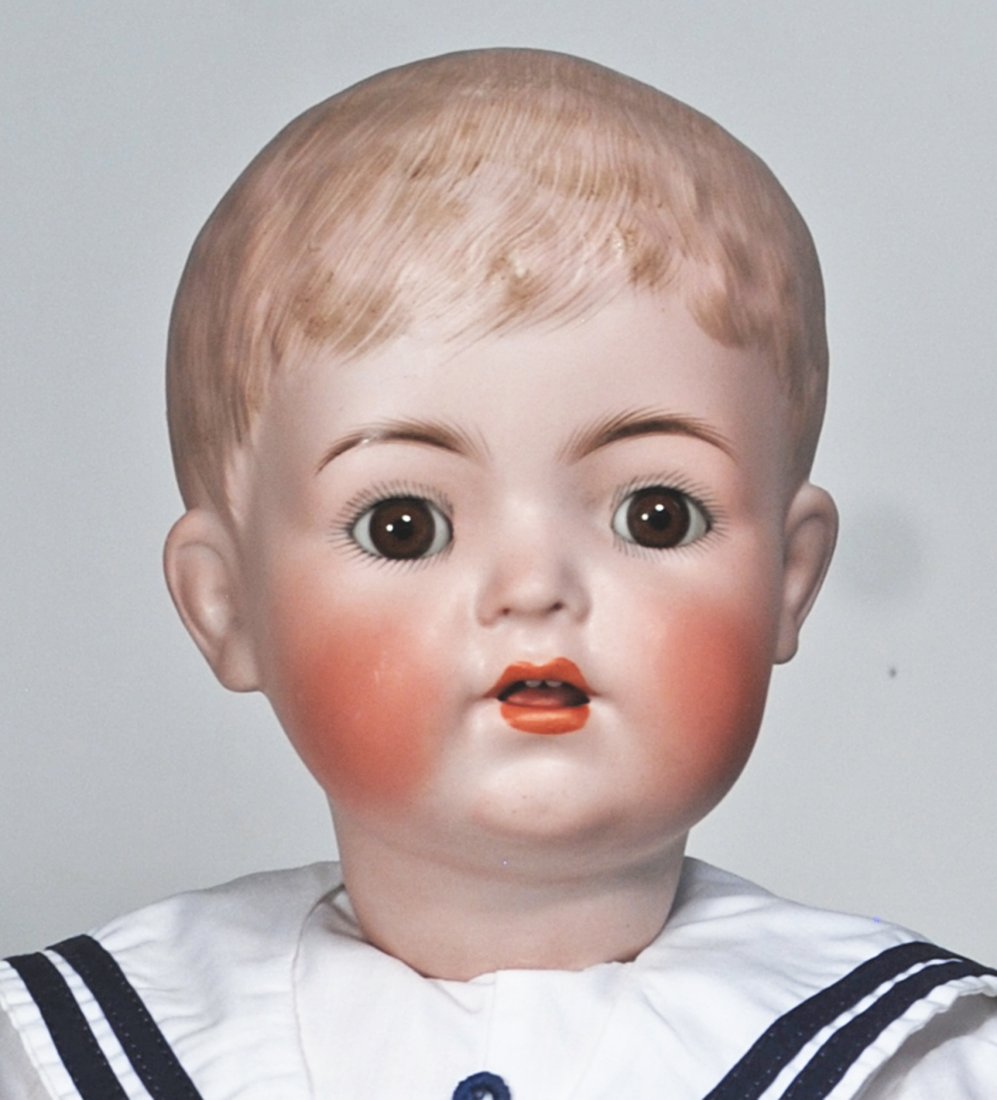 KAMMER AND REINHARDT, 127, CHARACTER WITH SCULPTED HAIR.: 115. KAMMER AND REINHARDT, 127, CHARACTER WITH SCULPTED HAIR. 24”. Marks: Germany, Simon & Halbig, K * R 127. Solid domed bisque socket head, brown sculpted hair in short boyish fashion, brown g