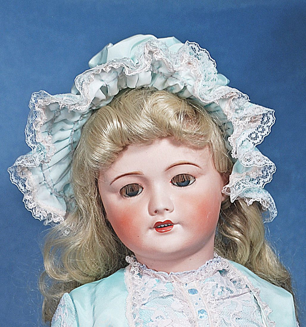 LARGE FRENCH BISQUE BEBE BY UNIS: 125. LARGE FRENCH BISQUE BEBE BY UNIS. 28”. Marks: 71 Unis France 149, 301. Bisque socket head, brown sleep eyes, painted and applied lashes, feathered brows, open mouth, upper teeth, pierced ea