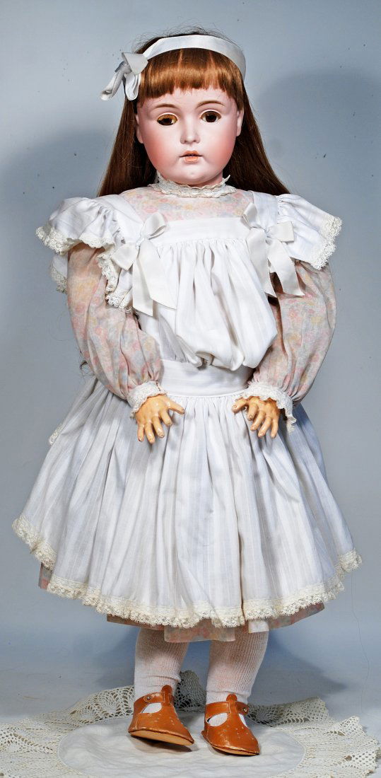 LARGER KESTNER 171 BISQUE DOLL: 143. LARGER KESTNER 171 BISQUE DOLL. 34”. Marks: made in Germany 171. Bisque socket head, brown sleep eyes, painted and applied lashes, open mouth, accented lips, upper teeth, human hair wig, co