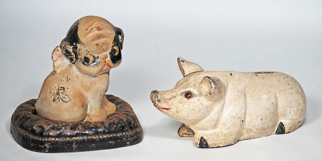 156.  TWO ANTIQUE CAST IRON COIN BANKS. (1 of 1)