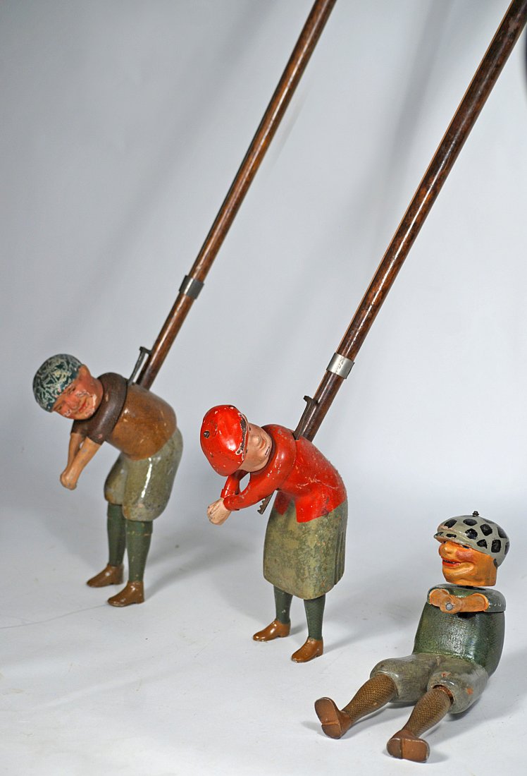 THREE SCHOENHUT WOODEN GOLFER TOYS. (1 of 1)