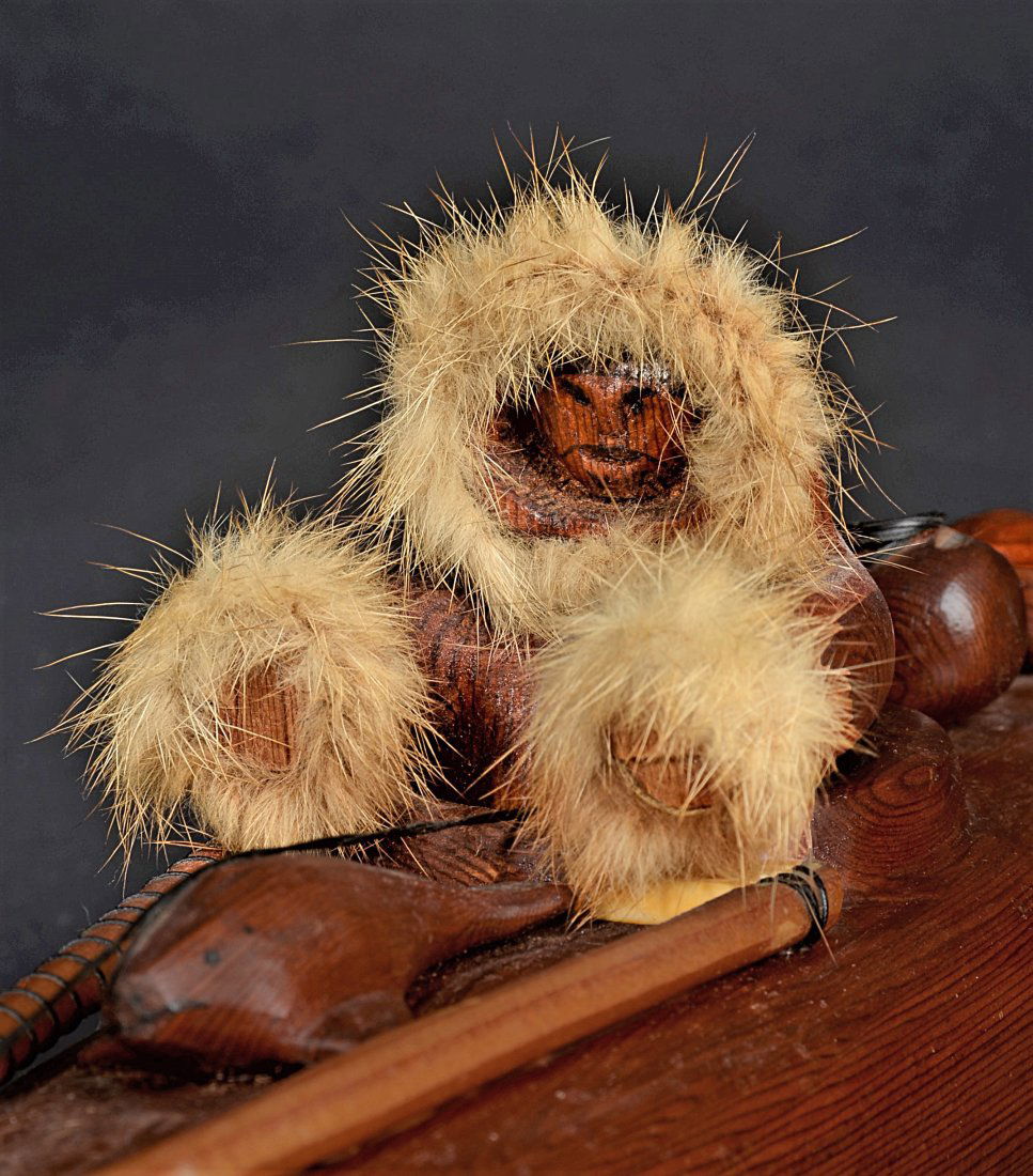 VINTAGE HAND CARVED WOODEN ESKIMO AND BOAT. (1 of 1)