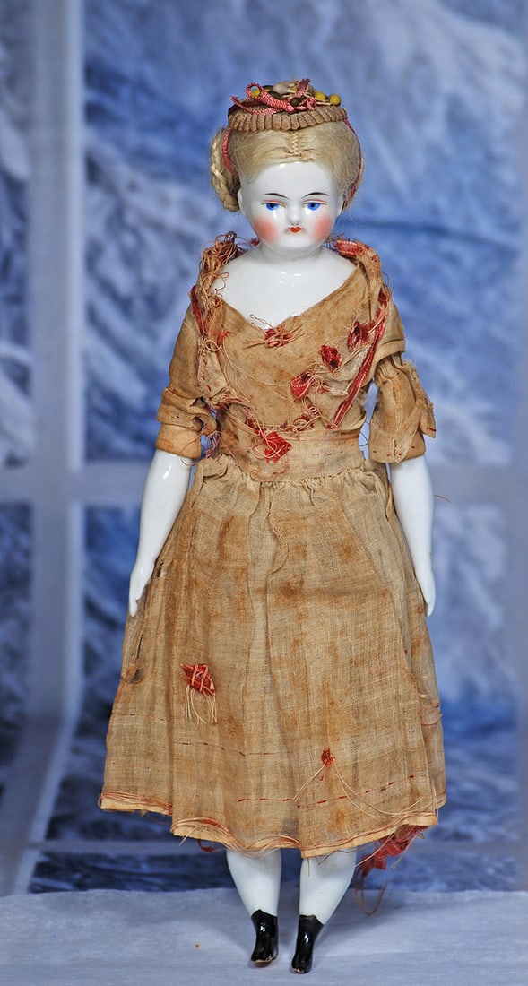 GERMAN PORCELAIN BIEDERMEIER LADY ATTRIBUTED TO KESTNER 11”: 11” Porcelain shoulderhead with painted black pate, original blonde mohair wig, painted features, blue eyes, red and black lid liner, tapered brows, tiny closed mouth, blushed cheeks, original c