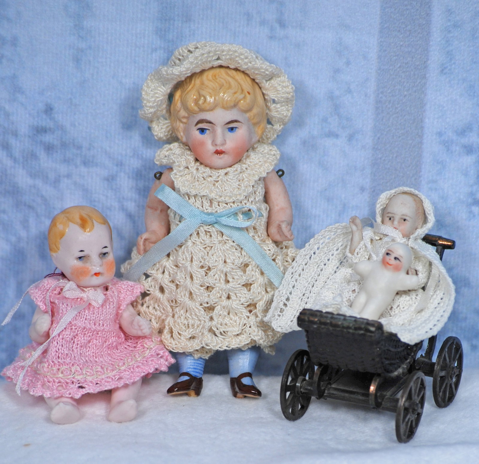 THREE MINIATURE ALL-BISQUE DOLLS Each is all-bisque with painted hair and painted features,: Each is all-bisque with painted hair and painted features, jointed shoulders and hips Includes 3 ½”