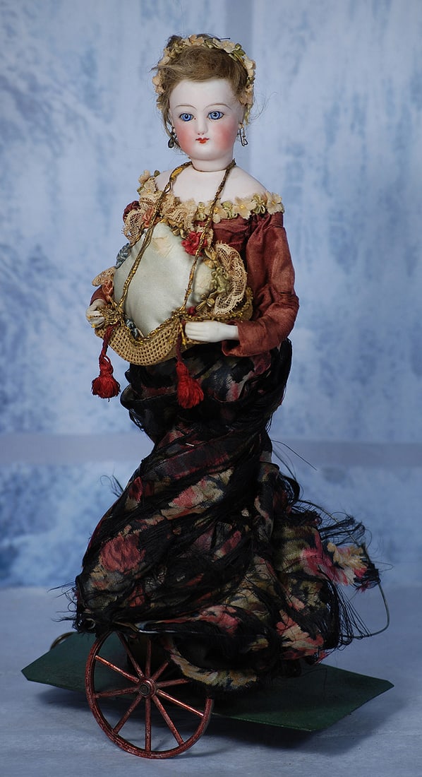 FRENCH MECHANICAL POUPEE ATTRIBUTED TO VICHY   12". (1 of 2)