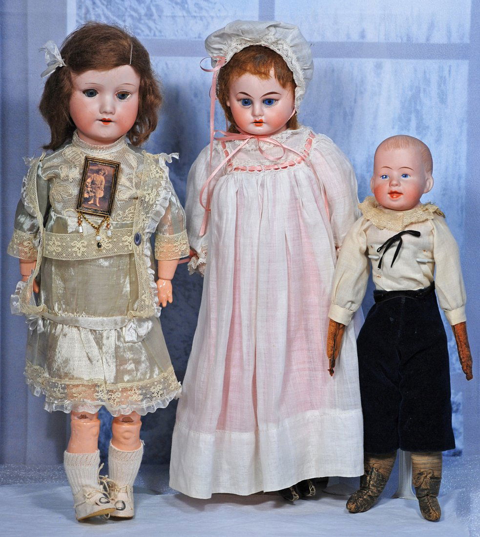 THREE GERMAN BISQUE DOLLS.: 286. THREE GERMAN BISQUE DOLLS. 16” bisque socket head doll marked A.M. 390, sleep eyes, open mouth, original mohair wig, original composition jointed body, silk dress; 15” bisque shoulder