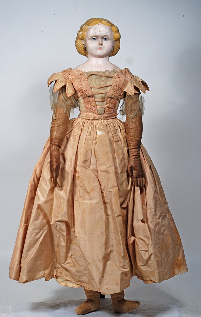 AMERICAN PRESSED LINEN HEAD DOLL BY GEORGE HAWKINS, IN ORIGINAL GOWN.: 15.AMERICAN LINEN HEAD DOLL BY GEORGE HAWKINS IN ORIGINAL GOWN. 27”. Paper mache shoulderhead with sculpted and painted blonde hair waved away from face, painted features, blue eyes, closed mout