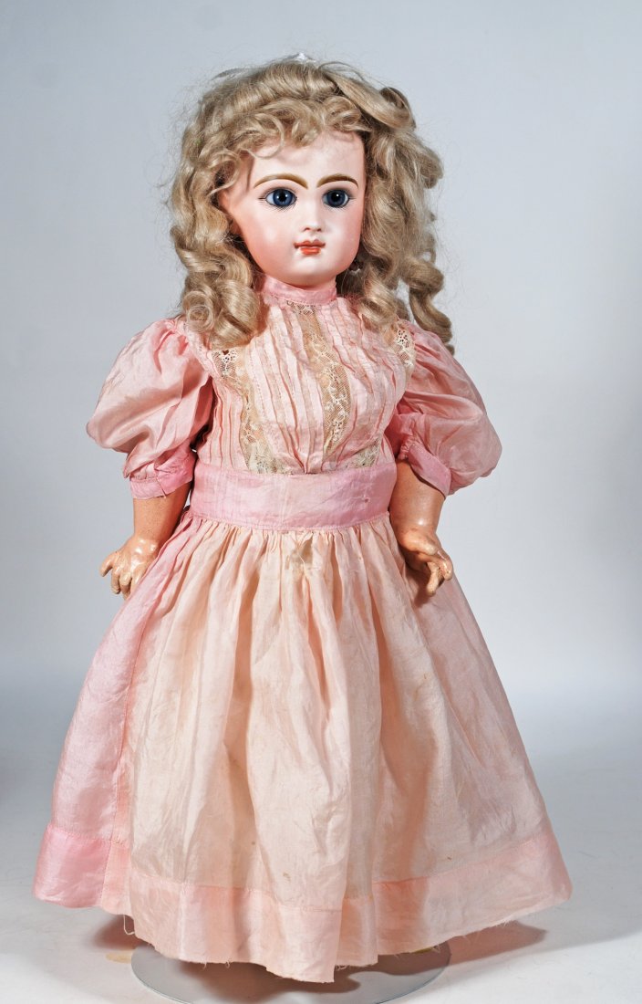 FRENCH BISQUE BEBE BY JUMEAU: 40. FRENCH BISQUE BEBE BY JUMEAU. 19”. Marks: Tete Jumeau Depose Bte SGDG 8. Bisque socket head, blue paperweight eyes, painted lashes, feathered brows, pierced ears, closed mouth, shaded and ac
