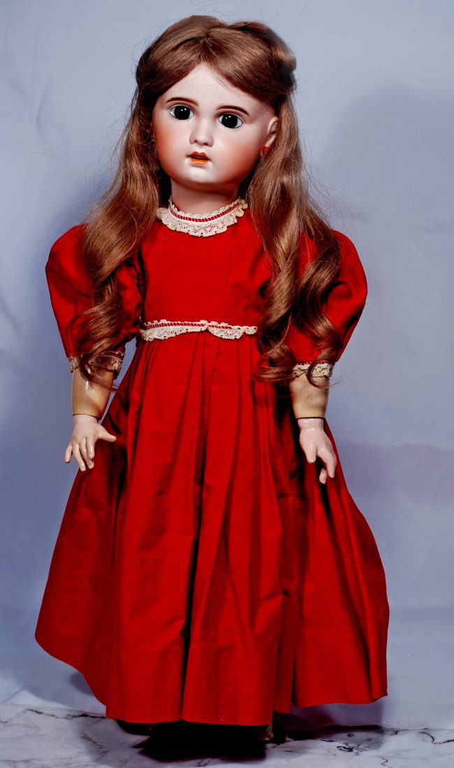 FRENCH BISQUE BEBE BY S.F.B.J: 64. FRENCH BISQUE BEBE BY S.F.B.J. Marks: SFBJ Paris 10. 22”. Bisque socket head, stationary brown glass eyes, painted lashes, eyeliner, feathered and brushstroked brows, pierced ears, open mout