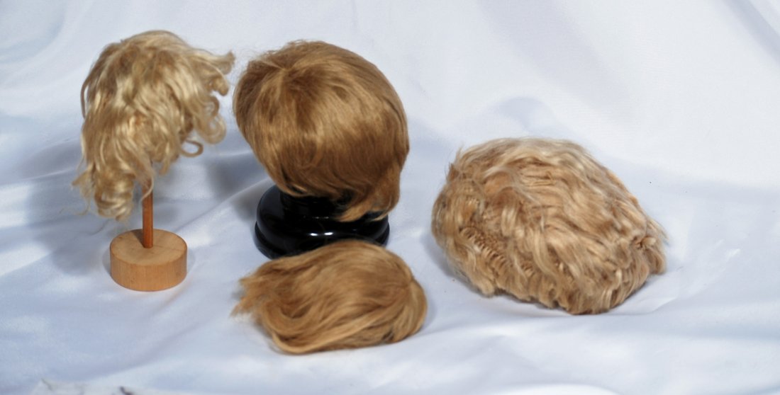 FOUR DOLL WIGS. (1 of 1)