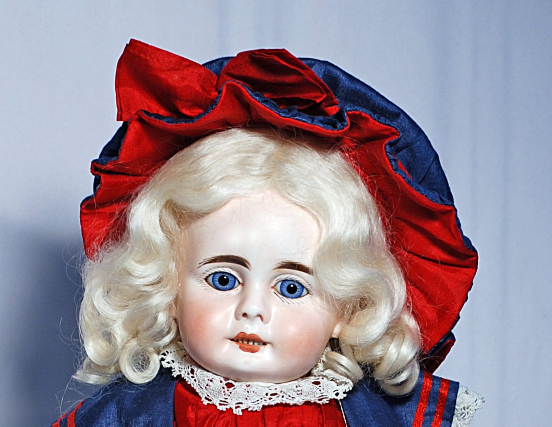GERMAN SONNEBERG BISQUE DOLL BY MYSTERY MAKER: 139.GERMAN SONNEBERG BISQUE DOLL BY MYSTERY MAKER. 20”. Marks: 9. Bisque socket head, stationary blue glass eyes, painted lashes, feathered brows, open mouth, six tiny upper teeth, blonde mohair