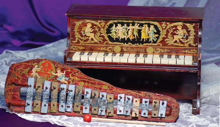 SCHOENHUT TOY PIANO AND XYLOPHONE: SCHOENHUT TOY PIANO AND XYLOPHONE. 15 ½” W. x 11” H. Rosewood piano with lithographed front panel and Schoenhut in gilt letters, wooden keys; 20” L. wooden xylophone with seventeen metal keys, 