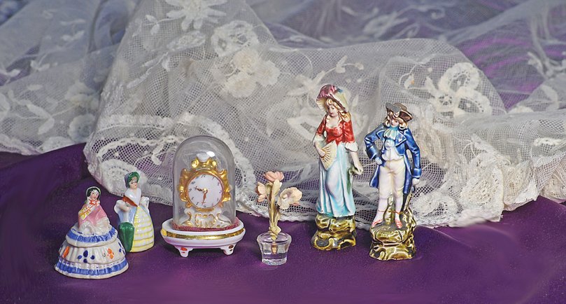 ANTIQUE MINIATURE ITEMS: ANTIQUE MINIATURE ITEMS. Includes: 2” trinket box depicting Jenny Lind doll with black hair, pastel bonnet, pink bodice and full skirt; 2” porcelain lady with parasol marked Germany, 3” gilt fra