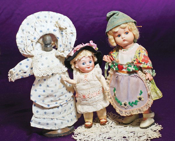 GERMAN BISQUE GOOGLY-EYED CHARACTER BY MARSEILLE: GERMAN BISQUE GOOGLY-EYED CHARACTER BY MARSEILLE. Marks: A.M.323. 7”. Bisque socket head, round blue glass side-glancing and sleep eyes, painted lashes, tapered brows, closed mouth, blonde lambs woo