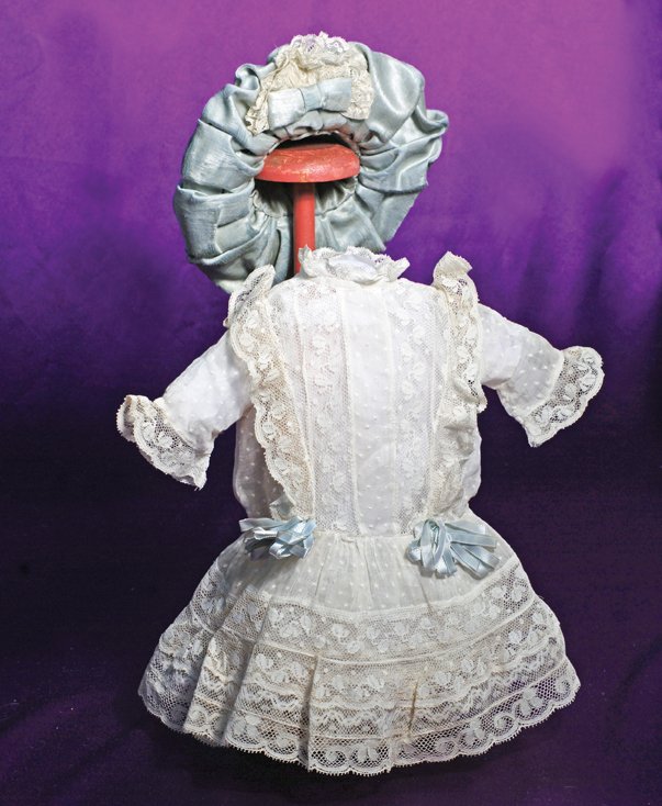 ANTIQUE LACE DOLL DRESS & BLUE SILK BONNET: ANTIQUE LACE DOLL DRESS & BLUE SILK BONNET. Sized to fit approximately 17”-18” doll. Dainty white dotted Swiss dress with slightly dropped waist, gathered skirt and underskirt, inset sleeves, vert