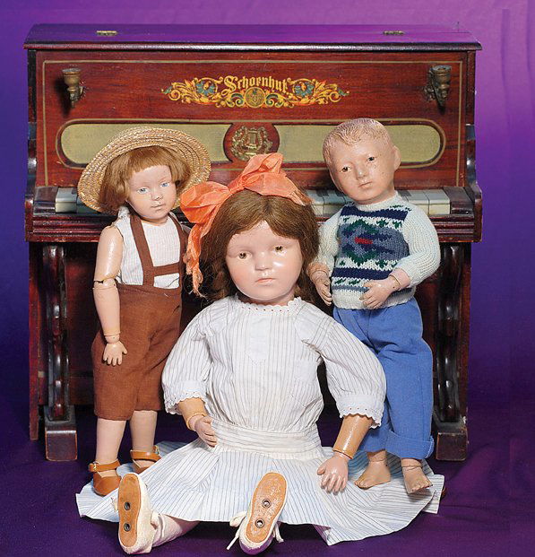 AMERICAN WOODEN DOLL “MODEL 312” CHARACTER BOY BY: AMERICAN WOODEN DOLL “MODEL 312” CHARACTER BOY BY SCHOENHUT. Marks: Schoenhut incised mark on back. 15”. Carved wooden socket head, painted features, blue intaglio eyes, upper eyeliner, feathere