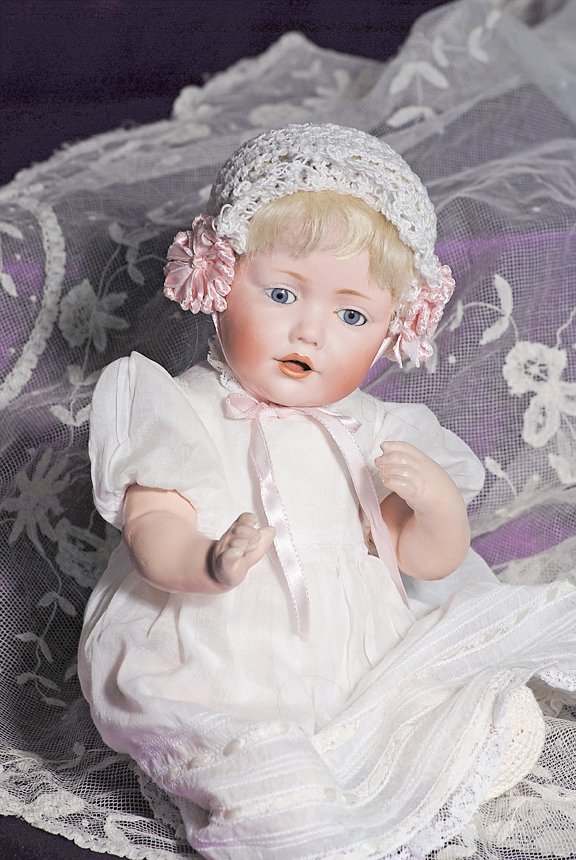 GERMAN BISQUE “HILDA” BABY BY KESTNER: GERMAN BISQUE “HILDA” BABY BY KESTNER. Marks; F made in Germany 10, 237 JDK © Hilda. 13”. Bisque socket head, blue sleep eyes, painted lashes, feathered brows, open mouth, shaded and accented l