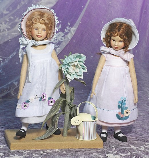 TWO MAGGIE MADE“MEADOW” DOLLSBY MAGGIE IACONO: TWO MAGGIE MADE“MEADOW” DOLLS BY MAGGIE IACONO. Marks: M. Iacono. 10 ½”. Each is all felt with swivel head and jointed body, dresses cotton costumes with felt appliques, come with felt stand, f