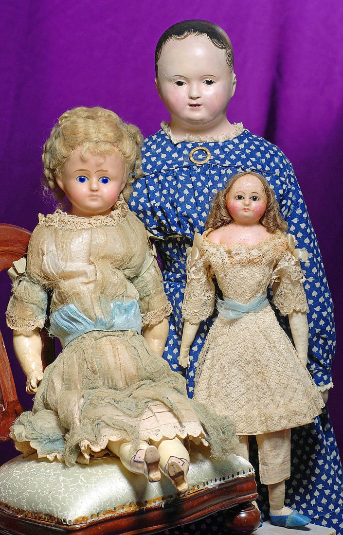 LOT OF 3 EARLY DOLLS: LARGE FRENCH PAPIER MACHE F: FRENCH PAPIER MACHE FASHION DOLL & TWO EARLY WAX DOLLS. 1) 26” Solid domed papier mache shoulderhead with black painted pate ending in tendrils of curLs framing the face, inset black glass eyes, pai