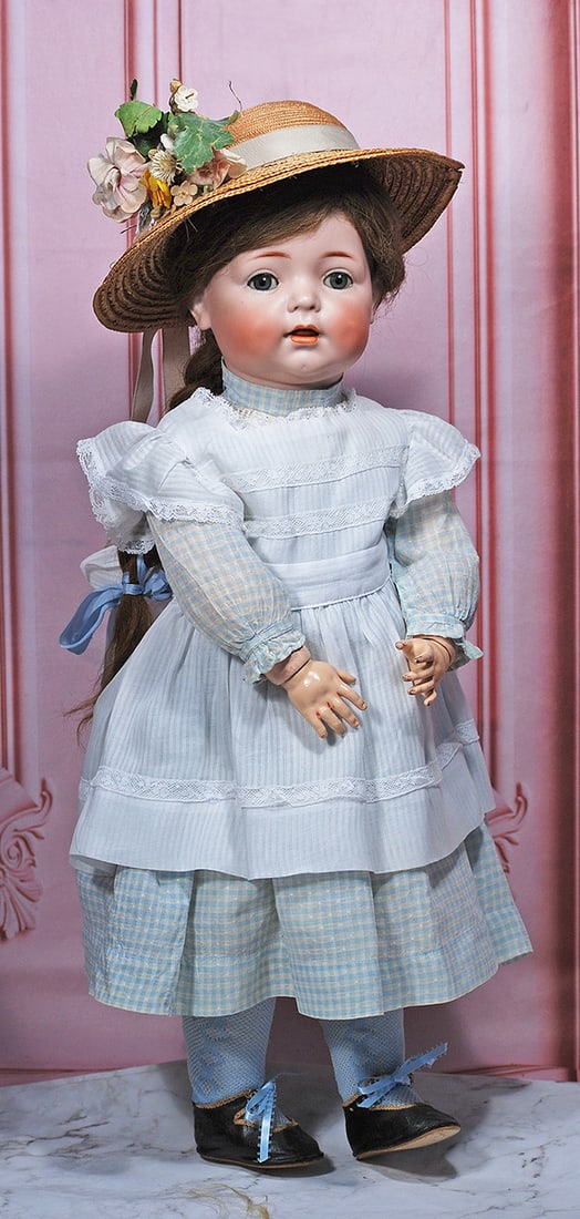 GERMAN BISQUE CHARACTER, 121, WITH TODDLER BODY BY KAMMER AND REINHARDT: 22” Marks: K * R, Simon & Halbig 121 Bisque socket head, blue sleep eyes, painted lashes and applied upper lashes, feathered brows, plump dimpled cheeks, open mouth, accented lips, upper teeth,