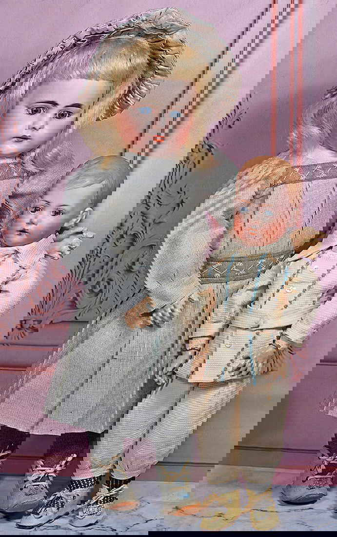 SIMON AND HALBIG, 719, GERMAN BISQUE CHILD: 18” Marks: S 10 H 719 DEP Bisque socket head, rounded face with plump cheeks, stationary blue glass eyes, painted lashes, feathered and brushstroked brows, pierced ears, open mouth with shaded a