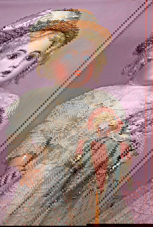 BEAUTIFUL, LARGE FRENCH BISQUE BEBE BY JUMEAU: 29” Marks: Tete Jumeau (red stamp) Bisque socket head, blue paperweight eyes, painted lashes, eyeliner, feathered and brushstroked brows, open mouth, accented lips, upper teeth, separately modeled a