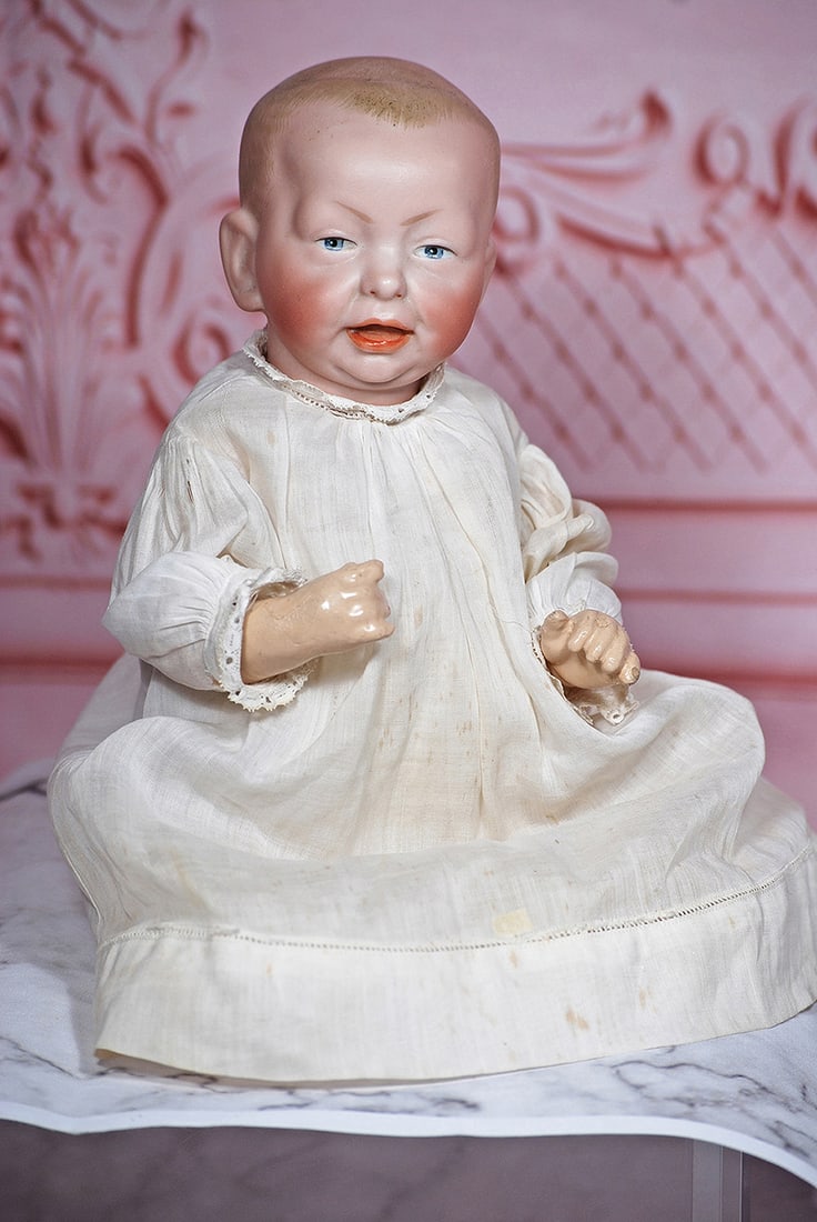 PETITE GERMAN BISQUE CHARACTER, 101, BY KAMMER AND REINDART: 11” Marks: K * R 101 Bisque socket head with sculpted and painted light brown hair, painted features, shaded blue eyes, eye liner, tapered brows, open/closed mouth with modeled detail between shaded