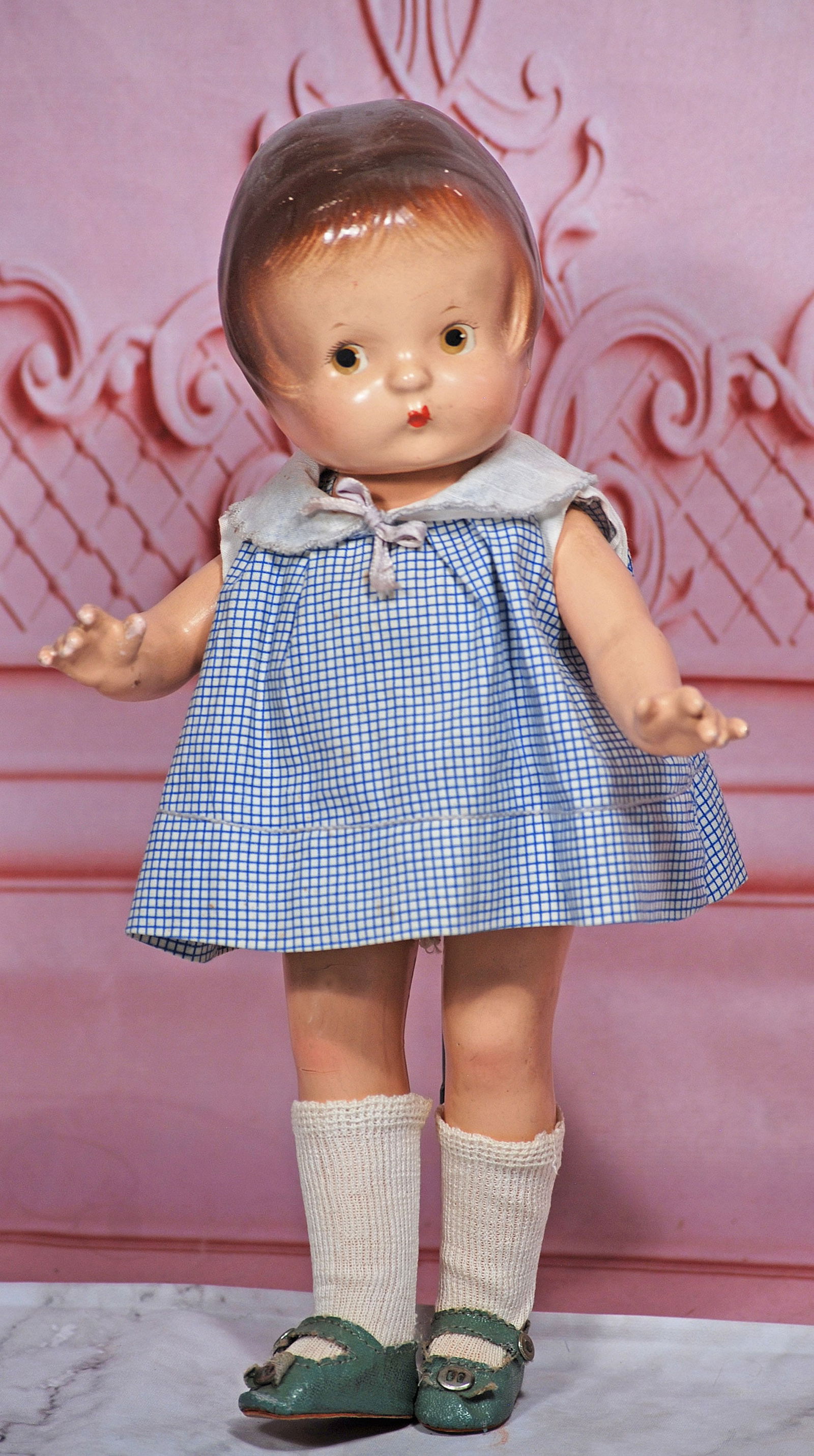 EFFANBEE COMPOSITION PATSY JR: 11” Composition socket head, five-piece composition jointed body, painted brown hair, painted features, original cotton dress and body suit, blue leatherette shoes Commentary: Good quality compositi