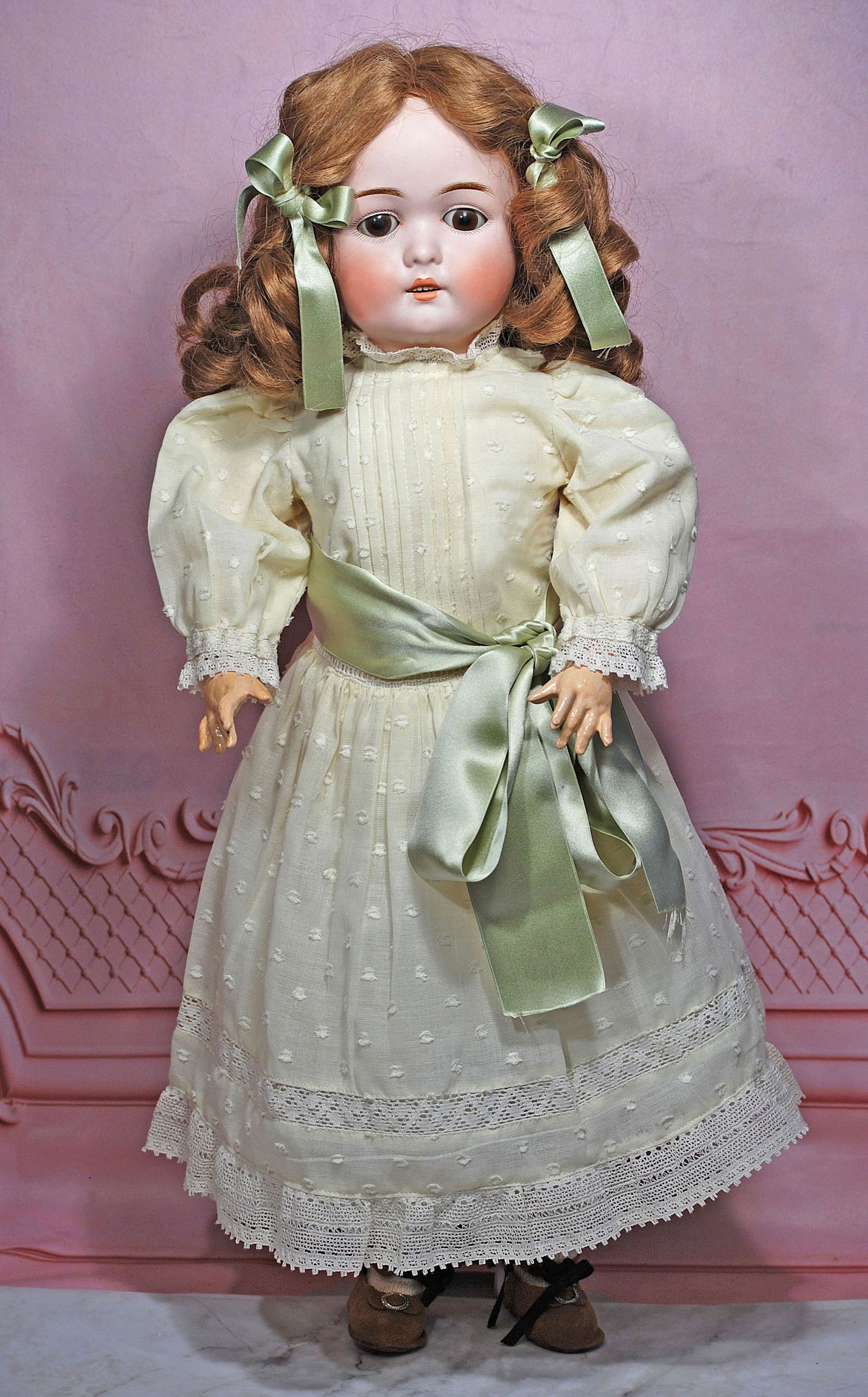 GERMAN BISQUE DOLL BY MYSTERY MAKER: 18” Marks: D A 9 Bisque socket head, brown sleep eyes, painted lashes, feathered brows, open mouth, accented lips, upper teeth, brown human hair wig, composition ball-jointed body, white cotton dres