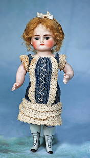 GERMAN ALL-BISQUE DOLL WITH GRAY ANKLE BOOTS ATTRIBUTED TO KESTNER: GERMAN ALL-BISQUE DOLL WITH GRAY ANKLE BOOTS ATTRIBUTED TO KESTNER. 9”. Marks: 2. All-bisque doll, short rounded face, jointed at shoulders and hips, stationary brown glass eyes, painted