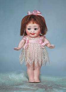 TINY LITTLE GERMAN ALL-BISQUE “OUR FAIRY”: TINY LITTLE GERMAN ALL-BISQUE “OUR FAIRY”. 5”. Marks: 222/ 12. All-bisque character, jointed at shoulders, brown sleep and side-glancing glass eyes, painted lashes, tapered