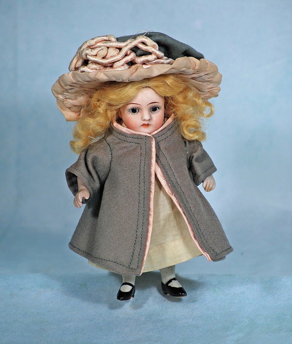 MINIATURE GERMAN ALL-BISQUE DOLL: MINIATURE GERMAN ALL-BISQUE DOLL. 5 ½”. Marks: 108. All-bisque doll jointed at shoulders and hips, brown sleep eyes, painted lashes, tapered brows, open/closed mouth with modeled teeth, pai
