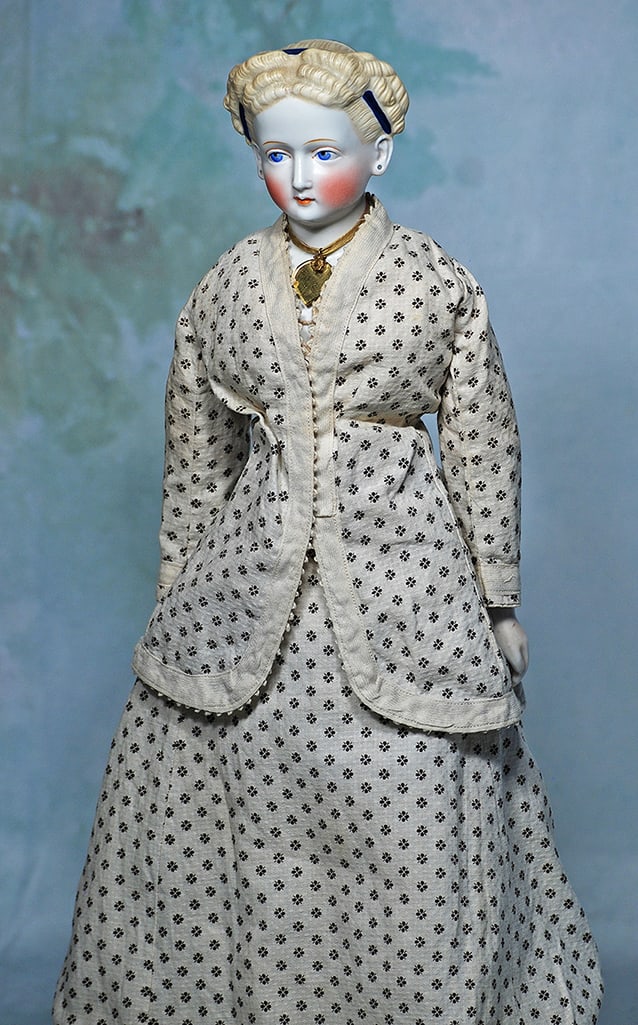 GERMAN BISQUE LADY WITH ELABORATE SCULPTED BLONDE HAIR: GERMAN BISQUE LADY WITH ELABORATE SCULPTED BLONDE HAIR. 18”. Bisque shoulderhead with oval-shaped face, deeply-sculpted blonde hair having multiple rows of horizontal rolled curls, pulled to the