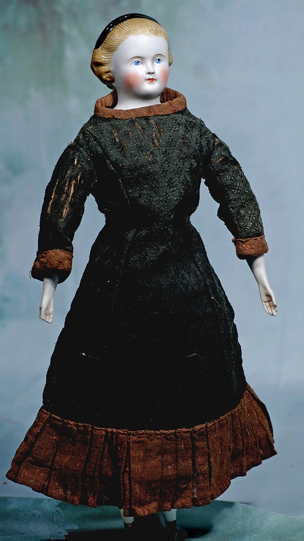 GERMAN BISQUE LADY WITH HAIR KNOWN AS “ALICE IN WONDERLAND”: GERMAN BISQUE LADY WITH HAIR KNOWN AS “ALICE IN WONDERLAND”. 16”. Marks: None. Bisque shoulderhead with sculpted café au lait hair having deep comb-marked detail with hair pulle