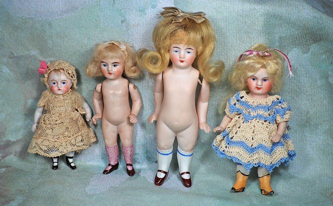 FOUR GERMAN ALL-BISQUE DOLLS (1 of 1)