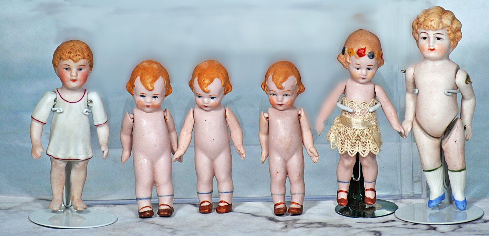 SIX MINIATURE ALL-BISQUE DOLLS (1 of 1)