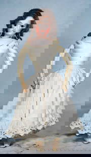 PETITE FRENCH BISQUE POUPEE BY GAULTHIER.: 5. PETITE FRENCH BISQUE POUPEE BY GAULTHIER. 11 ½”. Marks: 0 (head and shoulderplate). Bisque swivel head on bisque shoulderplate, inset brown glass eyes, painted lashes, feathered