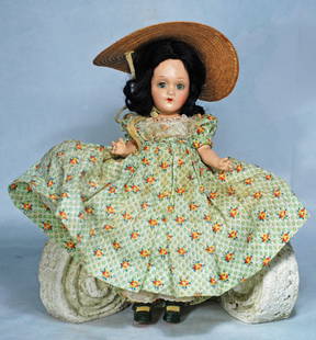 1939 COMPOSITION SCARLET O’HARA IN YELLOW ROSE PATTERNED GOWN BY ALEXANDER: 12. 1939 COMPOSITION SCARLET O’HARA IN YELLOW ROSE PATTERNED GOWN BY ALEXANDER. 11”. Composition socket head, five-piece jointed composition body, sleep eyes, painted and applied lashes,