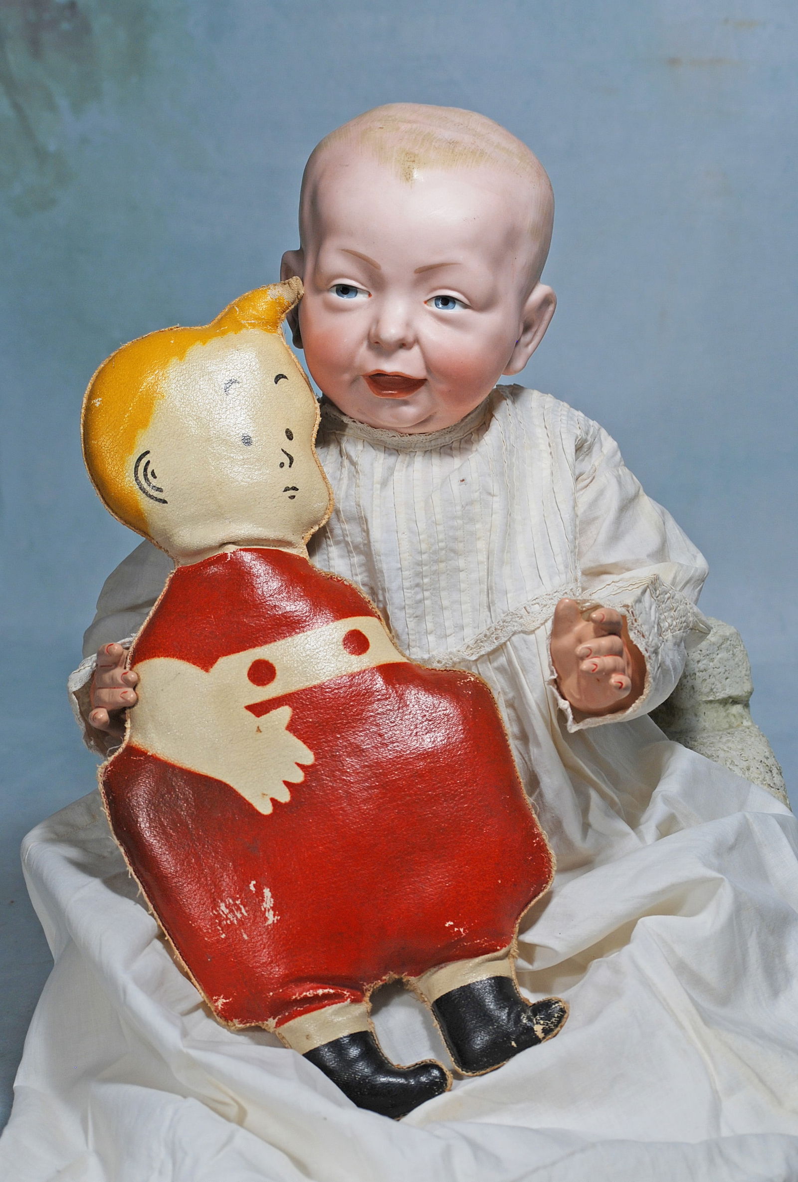 .KAMMER AND REINHARDT, 101, BISQUE CHARACTER BABY WITH “SKEEZIX” OIL CLOTH COMIC CHARACTER. (1 of 1)