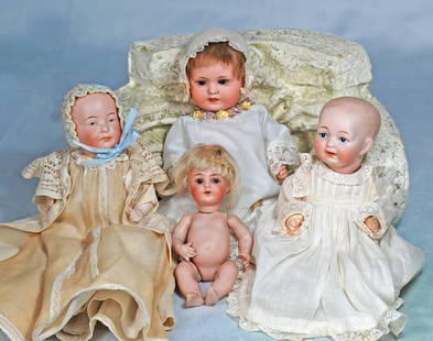FOUR SMALL GERMAN BISQUE CHARACTER BABIES.: 18. FOUR SMALL GERMAN BISQUE CHARACTER BABIES. 5” all-bisque baby with bent-limb body by Kammer and Reinhardt, brown sleep eyes, mohair wig; 6 ½” baby with painted eyes, closed