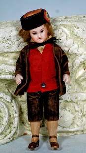 FRENCH ALL-BISQUE DOLL BY S.F.B.J.: 24. FRENCH ALL-BISQUE DOLL BY S.F.B.J. 5 ¾”. Marks: Paris 2. Bisque socket head, sleep eyes, painted lashes, tapered brows, closed mouth, mohair wig, five-piece jointed bisque body,