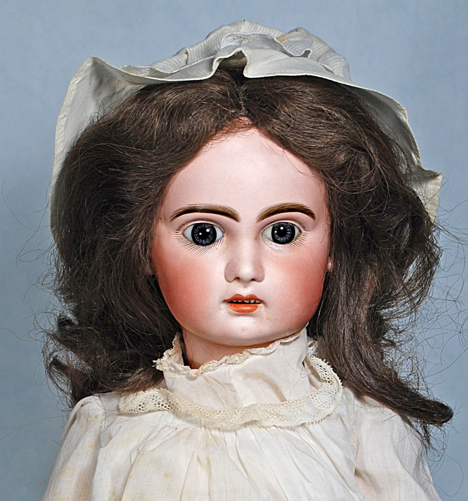 FRENCH BISQUE BEBE JUMEAU “X”: 80. FRENCH BISQUE BEBE JUMEAU “X”. 22”. Marks X 8. Bisque socket head, blue paperweight eyes, painted lashes, feathered brows, pierced ears, open mouth, accented lips, upper teeth, origi