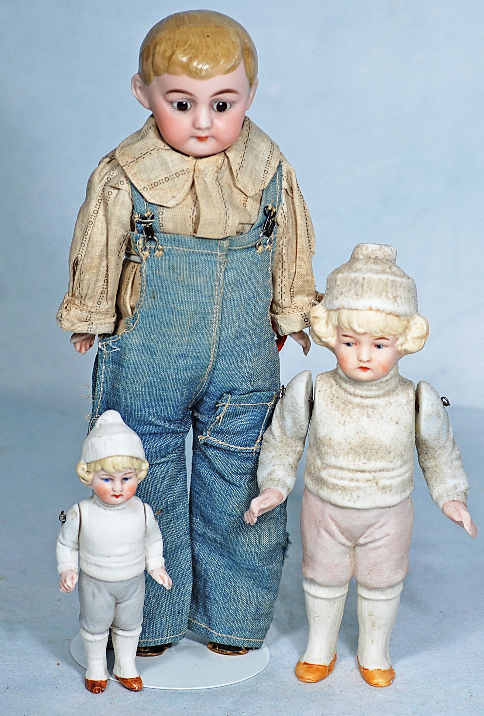 GERMAN BISQUE “AMERICAN SCHOOL BOY” AND TWO ALL-BISQUE DOLLS. (1 of 1)