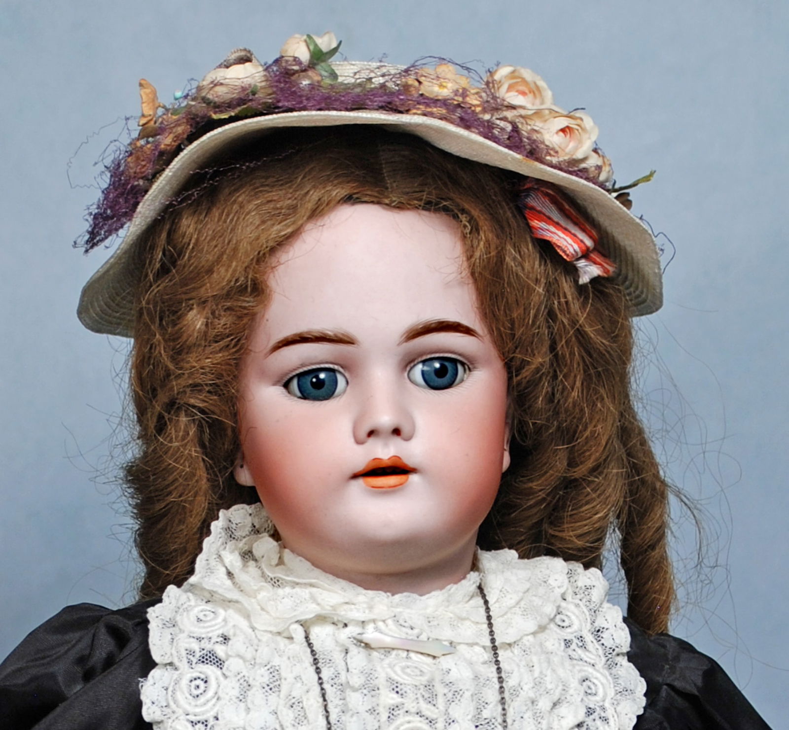 GERMAN BISQUE DOLL BY HANDWERCK.: 107. GERMAN BISQUE DOLL BY HANDWERCK. 22”. Marks: 99 Dep. Bisque socket head, blue sleep eyes, painted lashes and brows, open mouth, accented lips, upper teeth, brown mohair wig, composition bal