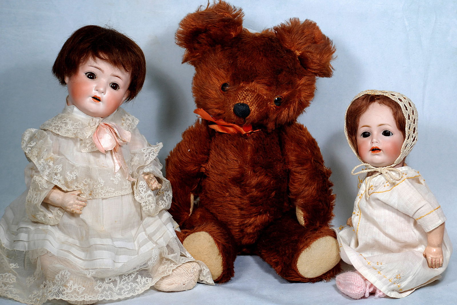 TWO GERMAN BISQUE DOLLS AND TEDDY BEAR. (1 of 1)