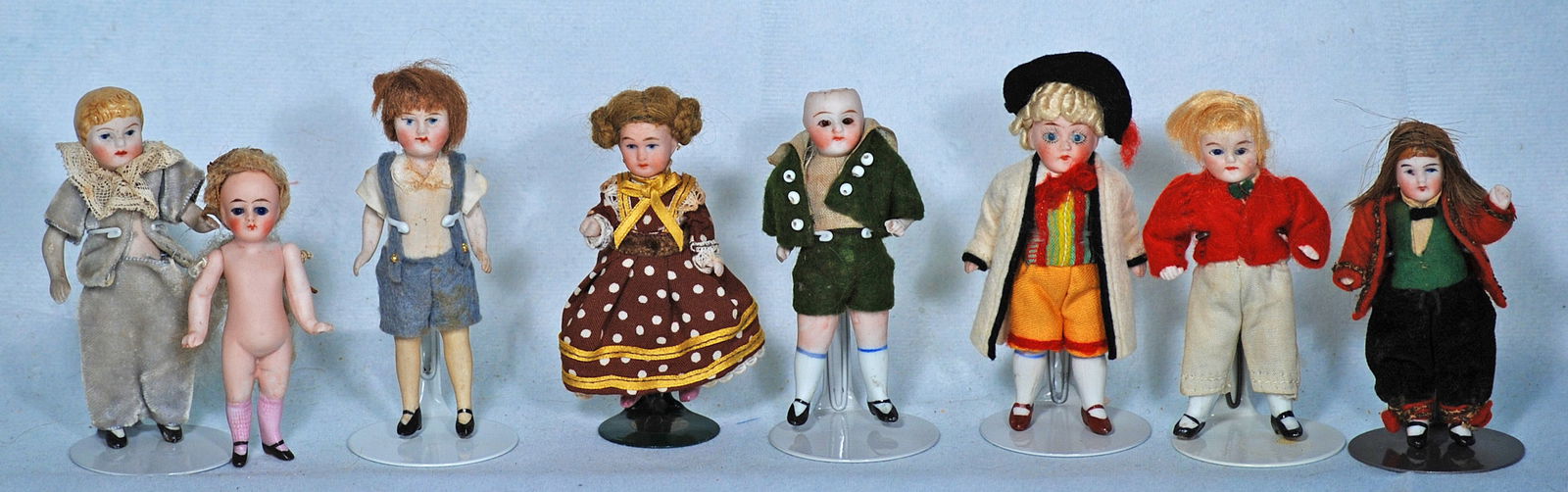 EIGHT MINIATURE DOLL HOUSE BISQUE DOLLS (1 of 1)
