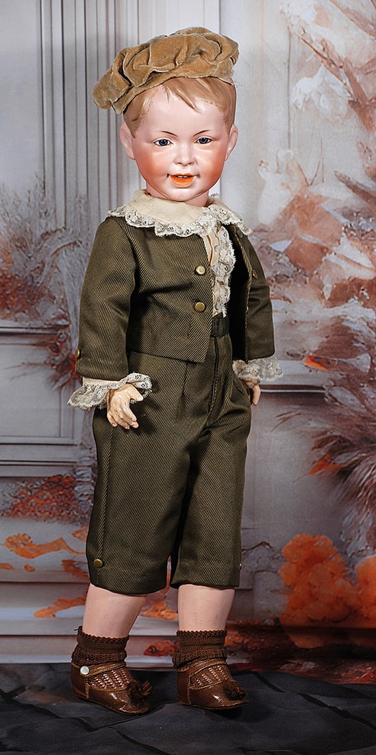FRENCH BISQUE CHARACTER CHILD, 235, BY S.F.B.J.: FRENCH BISQUE CHARACTER CHILD, 235, BY S.F.B.J. 21". Marks: SFBJ 235 Paris. Bisque solid-dome socket head with sculpted and side-parted light brown hair in boyish style with forelock, inset blue glass
