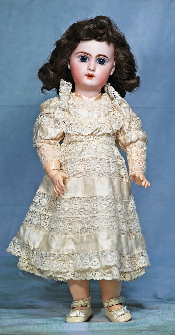 FRENCH BISQUE BEBE BY JUMEAU.: FRENCH BISQUE BEBE BY JUMEAU. 16". Marks: 7. Bisque socket head, blue paperweight eyes, painted lashes, feathered brows, open mouth, upper teeth, pierced ears, synthetic wig, French composition jointe