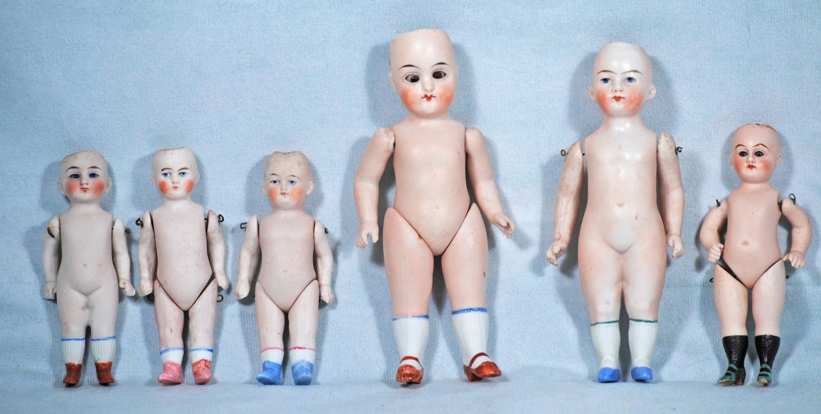 SIX GERMAN ALL-BISQUE DOLLS. (1 of 1)